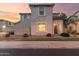 Charming home with traditional windows, covered entryway, and lush landscaping at 8468 W Lewis Ave, Phoenix, AZ 85037