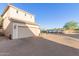 Spacious garage with brick driveway, desert landscaping and ample parking at 8468 W Lewis Ave, Phoenix, AZ 85037