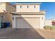 Spacious garage with brick driveway, desert landscaping and ample parking at 8468 W Lewis Ave, Phoenix, AZ 85037