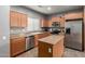 Functional kitchen featuring stainless steel appliances, tile floors, and ample counter space at 8468 W Lewis Ave, Phoenix, AZ 85037