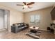 Inviting living room area with tile floors, a ceiling fan, and comfortable seating arrangement at 8468 W Lewis Ave, Phoenix, AZ 85037