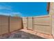 Fenced patio with patterned pavers, perfect for relaxing and entertaining outdoors at 8468 W Lewis Ave, Phoenix, AZ 85037