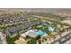 Aerial view of community amenities including swimming pools, tennis courts, parks, recreation center, and parking at 8516 W Clemente Way, Florence, AZ 85132