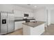 Bright kitchen features stainless steel appliances, granite countertops, and an island with a sink at 8516 W Clemente Way, Florence, AZ 85132