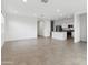 Open concept living space with tile flooring next to a modern kitchen, and recessed lighting at 8516 W Clemente Way, Florence, AZ 85132