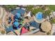 Aerial view of colorful community playground with sunshades, play structures, and landscaped areas at 8516 W Clemente Way, Florence, AZ 85132