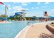 Water park featuring a splash area with slides, a large pool, and lounge chairs at 8516 W Clemente Way, Florence, AZ 85132