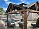Backyard featuring a gazebo, pool, and patio furniture, perfect for outdoor entertaining at 8820 W Glenn Dr, Glendale, AZ 85305