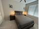 Cozy bedroom with modern lamps and a ceiling fan at 8820 W Glenn Dr, Glendale, AZ 85305