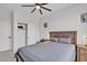 Bright bedroom features closet, and neutral decor to create a comfortable space at 8820 W Glenn Dr, Glendale, AZ 85305