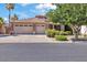 Charming home featuring a three-car garage, desert landscaping, and a tile roof at 8820 W Glenn Dr, Glendale, AZ 85305