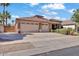 Well-maintained home with a spacious driveway and a three-car garage at 8820 W Glenn Dr, Glendale, AZ 85305