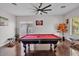 Recreation room features a red billiard table and plenty of room for fun and relaxation at 8820 W Glenn Dr, Glendale, AZ 85305