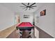 Bright game room offering a billiard table, accent lighting, and hardwood flooring at 8820 W Glenn Dr, Glendale, AZ 85305
