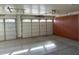 Clean, organized garage with ample storage cabinets and durable epoxy flooring at 8820 W Glenn Dr, Glendale, AZ 85305