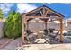 Backyard gazebo with outdoor seating and a built-in barbecue grill at 8820 W Glenn Dr, Glendale, AZ 85305