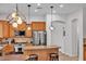 Large kitchen with stainless appliances, spacious island, and cabinetry at 8820 W Glenn Dr, Glendale, AZ 85305