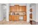 Kitchen features custom cabinets, granite countertops, and a designated coffee bar area at 8820 W Glenn Dr, Glendale, AZ 85305