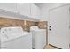 Functional laundry room equipped with a washer and dryer for convenience at 8820 W Glenn Dr, Glendale, AZ 85305