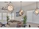 Elegant living room with modern lighting and comfortable seating at 8820 W Glenn Dr, Glendale, AZ 85305