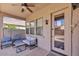 Covered patio with comfortable seating, ceiling fan, and view to the backyard pool at 8820 W Glenn Dr, Glendale, AZ 85305