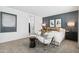 Spacious main bedroom with a modern accent wall, elegant furnishings, and ample natural light at 9343 S Mineros Dr, Apache Junction, AZ 85120