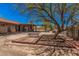 Large residential lot featuring a pergola, shade trees, and the back of the main home at 10480 W Martin Rd, Casa Grande, AZ 85194