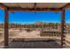 Desert backyard view from the covered patio with scenic mountain views in the distance at 10480 W Martin Rd, Casa Grande, AZ 85194