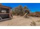 Residential backyard with a play structure, desert landscaping, and privacy fencing at 10480 W Martin Rd, Casa Grande, AZ 85194