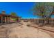 Residential lot featuring a pergola, desert landscaping, and the home's covered patio at 10480 W Martin Rd, Casa Grande, AZ 85194