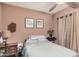 Bedroom with ceiling fan, wood-look floors, and natural light at 10480 W Martin Rd, Casa Grande, AZ 85194