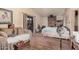 Open bedroom with a brick fireplace, access to a private balcony, and a comfortable sitting area at 10480 W Martin Rd, Casa Grande, AZ 85194