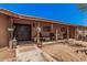 Inviting front porch with chairs and decorative touches, perfect for relaxing outdoors at 10480 W Martin Rd, Casa Grande, AZ 85194