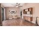 Inviting living room with tile floors, ceiling fan, and built in storage shelves at 10480 W Martin Rd, Casa Grande, AZ 85194