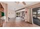 Spacious living room features a fireplace, tile flooring and sliding door to exterior at 10480 W Martin Rd, Casa Grande, AZ 85194