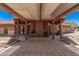 Covered patio area featuring a built-in barbecue grill and storage cabinet at 10480 W Martin Rd, Casa Grande, AZ 85194