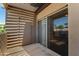 Private covered balcony with sliding glass door and storage closet at 11260 N 92Nd St # 2102, Scottsdale, AZ 85260