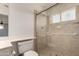 Bathroom features a tiled walk-in shower with glass door and grab bars at 11260 N 92Nd St # 2102, Scottsdale, AZ 85260