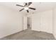 Empty bedroom features ceiling fan, carpet, and has an adjoining room at 11260 N 92Nd St # 2102, Scottsdale, AZ 85260