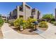 Inviting community barbecue area with lush landscaping and a grill, set against the backdrop of the building's architecture at 11260 N 92Nd St # 2102, Scottsdale, AZ 85260