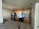 Updated kitchen featuring stainless steel appliances, granite countertops, and wood cabinetry at 11260 N 92Nd St # 2102, Scottsdale, AZ 85260