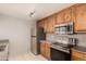 Modern kitchen features stainless steel appliances, granite countertops, and updated cabinetry at 11260 N 92Nd St # 2102, Scottsdale, AZ 85260