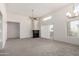 Bright, spacious living room with carpet, ceiling fan, and a fireplace with plenty of natural light at 11260 N 92Nd St # 2102, Scottsdale, AZ 85260