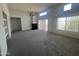 Spacious living room with fireplace, high ceilings, lots of natural light, and neutral carpeting at 11260 N 92Nd St # 2102, Scottsdale, AZ 85260
