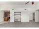 Spacious living room with built-in shelving and views of the kitchen area at 11260 N 92Nd St # 2102, Scottsdale, AZ 85260