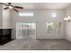 Bright living area features carpet, vaulted ceilings, a fireplace, and large window with outside views at 11260 N 92Nd St # 2102, Scottsdale, AZ 85260