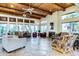 Spacious living room with high wood ceilings, a fireplace, and ample natural light, perfect for entertaining and relaxation at 11260 N 92Nd St # 2102, Scottsdale, AZ 85260