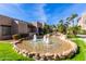 Scenic community fountain with desert landscaping, enhancing the outdoor ambiance of the condo complex under a clear sky at 11260 N 92Nd St # 2102, Scottsdale, AZ 85260