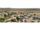 A beautiful aerial view of homes in a desert landscape with a tile roof and well-kept yard at 11439 E Bella Vista St, Scottsdale, AZ 85259