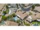 Aerial view of the home showcasing the pool, landscaped backyard, and tile roof in a quiet neighborhood at 11439 E Bella Vista St, Scottsdale, AZ 85259